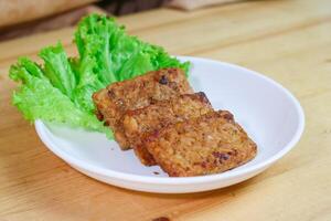 Tempe bacem is a processed tempe that comes from Central Java. Has a distinctive sweet taste because it uses palm sugar. Actually baceman is a technique of preserving food naturally. photo