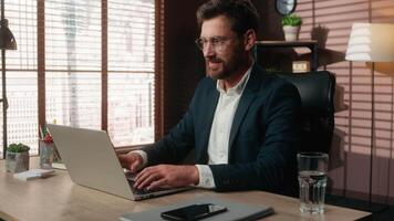 Happy Caucasian middle-aged adult man business businessman male guy entrepreneur finish work online close laptop in office smile accomplishment complete internet job relax pause put hands behind head video