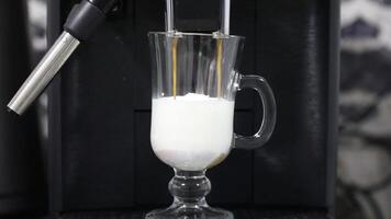 Making a traditional cappuccino with cream in a coffee machine video