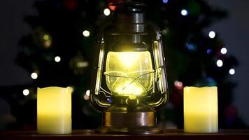Relaxing Christmas scene with lit lantern and ditches and rain running down the window pane video