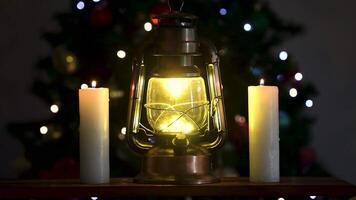 Relaxing Christmas scene with lit lantern and ditches and rain running down the window pane video