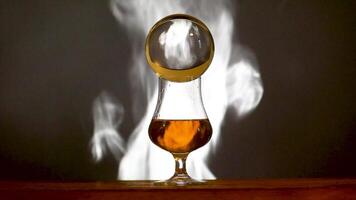 Peated single malt scotch whiskey with moving smoke background video