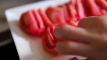 Cutting Tomato Slice with Sharp Knife on the Wooden Chopping Board and Splashing Water video