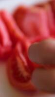 Cutting Tomato Slice with Sharp Knife on the Wooden Chopping Board and Splashing Water video
