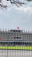 Frontal perspective of Independence Palace or Reunification Palace Dinh Doc Lap is designed a main public landmark in the afternoon by architect Ngo Viet Thu video