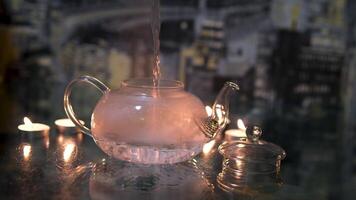 pour boiling water into a glass teapot Glass teapot with tea, pour boiling water. video