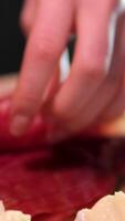 ham and brie cheese Jamon or dry-cured ham produced in Spain texture close up. 4K resolution Food background. Hand in glove take thin slice of jamon video