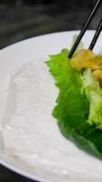 spring rolls Summer rolls with fresh vegetables and meat and peanut sauce. Vietnamese appetizer. Salad spring rolls with pork. Healthy food concept video