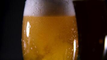Super slow motion of pouring beer into pint in motion. Filmed on high speed cinema camera. Camera placed on high speed cine bot. Speed ramp effect. video