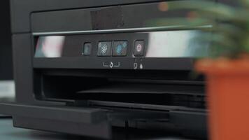 Exploring the various functions of a modern printer with close-up details on controls during a printing demonstration video