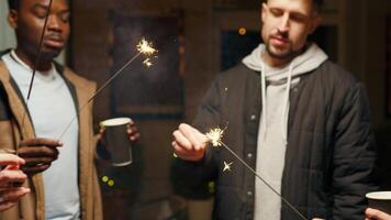 Celebrating with friends as we light sparklers indoors during a cozy winter gathering at home video