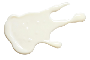 A white liquid splashed on a black surface png