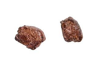 Grilled fillet mignon or tenderloin beef steak on kitchen table. Isolated on white background. photo