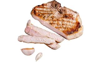 Grilled pork Chop or T-bone meat steak sliced on a wooden board. Isolated, white background. photo