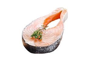 fresh raw salmon steak with pepper and thyme. Isolated on white background. Top view. photo