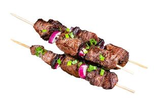 Shish kebab with beef and lamb meat, onion and herbs on Skewers. Isolated, white background. photo