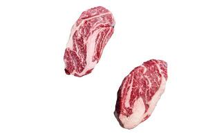 Raw chuck eye roll steaks, premium beef meat on a butcher board. High quality Isolate, white background. photo
