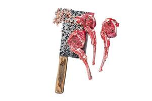 Raw uncooked lamb mutton meat chops steaks on a butcher cleaver. Isolated on white background, top view. photo