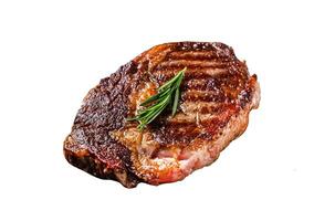 Roasted rib eye steak, ribeye beef meat in a grill pan. Isolated on white background. photo