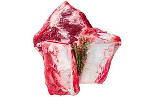 Uncooked Raw veal Short Ribs on rustic plate with rosemary. Isolated on white background. photo