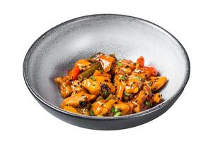 Chinese Sweet and Sour Pork guo bao rou in a bowl. Isolated on white background. Top view. photo