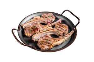 BBQ with Grilled lamb meat chops, mutton steaks with herbs. Isolated on white background. Top view. photo