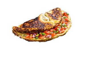 Stuffed omelette with tomatoes, red bell pepper and onion on wooden board. High quality Isolate, white background. photo
