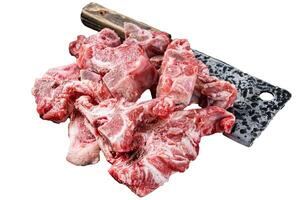 Uncooked Raw meat diced for stew on a butcher board. Isolated, white background. photo