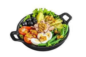 Gourmet nicoise salad with vegetables, eggs, tuna and anchovies Isolated on white background, Top view. photo