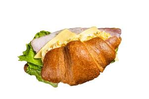 Croissant sandwich with egg cheese and green lettuce salad leaf, healthy breakfast. Isolated on white background. photo