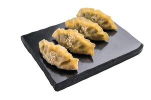 Steamed Chinese Jiaozi Dumplings with meat and vegetables isolated on white background. top view photo