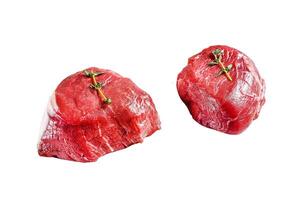 Marble beef tenderloin. Raw filet Mignon steak Isolated on white background. Top view. photo