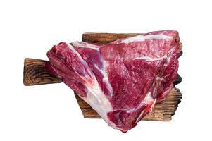 Raw lamb mutton thigh on butcher table. Isolated on white background photo