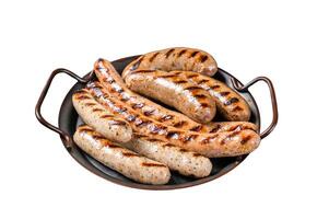 Grilled Bratwurst meat sausages on a steel tray with herbs. Isolated on white background. Top view. photo