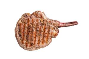BBQ Grilled Tomahawk beef veal steak on butcher table. Isolated on white background. photo