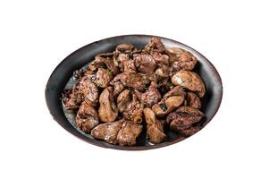 Fried chicken liver with onions and herbs. Isolated on white background. Top view. photo