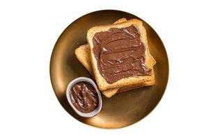 Stack of Toasts with chocolate Hazelnut cream in plate. Isolated on white background. photo