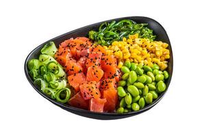Salmon Poke bowl with Cucumber, Edamame, and Rice. Isolated, white background. photo