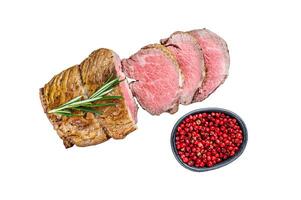 Roast beef fillet Tenderloin meat Isolated on white background, top view. photo