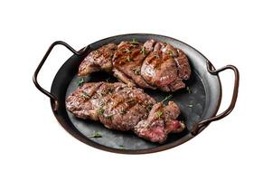 Grilled Lamb chop leg steaks, mutton meat with herbs. Isolated on white background. Top view. photo