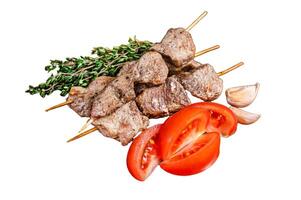 Bbq lamb meat on wooden skewers with vegetables Isolated on white background, top view. photo