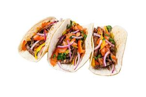 Tacos with beef meat, onion, tomato, sweet pepper and salsa. Mexican food. Isolated on white background, Top view. photo