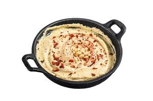 Hummus dip with chickpea in a bowl. Isolated on white background photo