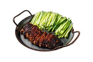 Peking Duck served with cucumber, green onions, and roasted wheaten chinese pancakes with sauce Hoysin. Isolated on white background. Top view. photo
