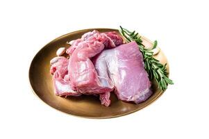 Fresh skinless raw Turkey thigh fillet meat with spices. Isolated on white background. Top view. photo