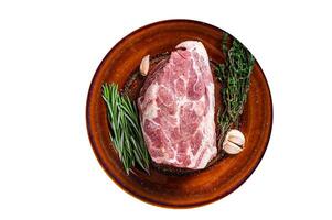 Fresh raw Pork Neck meat steak in rustic plate. High quality Isolate, white background. photo