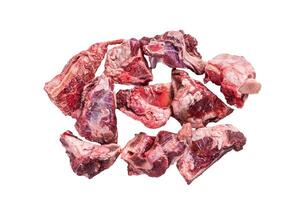 Raw lamb meat stew cuts with bone. Isolated on white background. photo