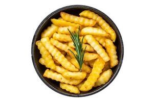 Fried Crinkle French fries potatoes in a pan. Isolated, white background. Top view. photo