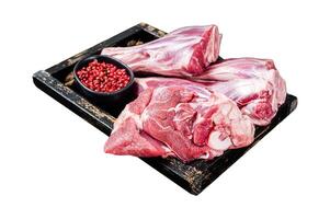 Fresh Raw lamb shanks with herbs and spices, mutton meat. Isolated on white background. Top view. photo