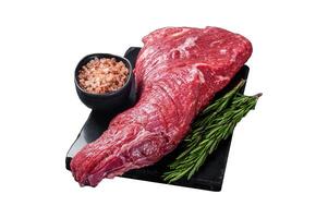 Raw American Tri Tip beef steak on marble board. Isolated on white background. Top view. photo